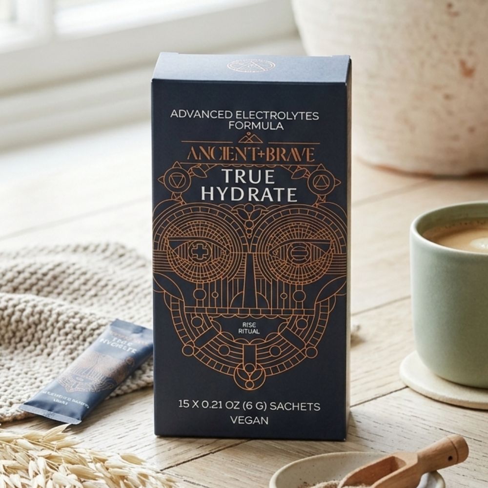 Ancient + Brave True Hydration Powder Container on a kitchen table.