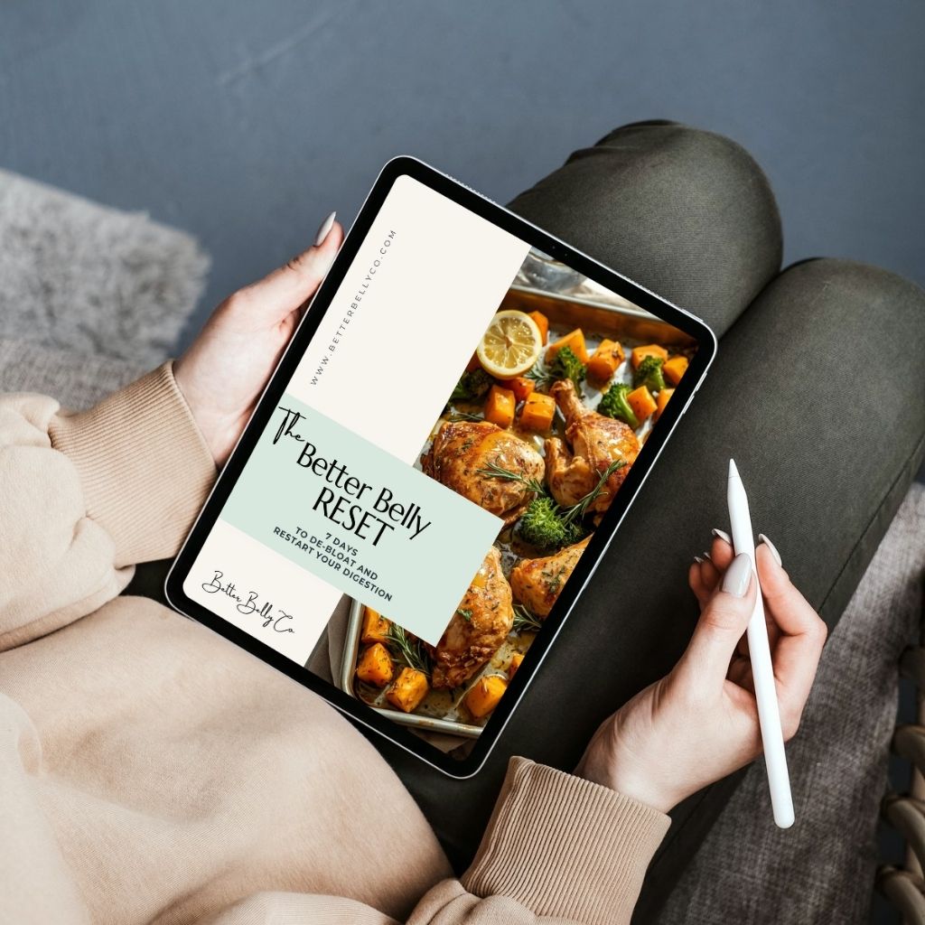 A woman looking at 'The Better Belly Reset Plan' on her tablet