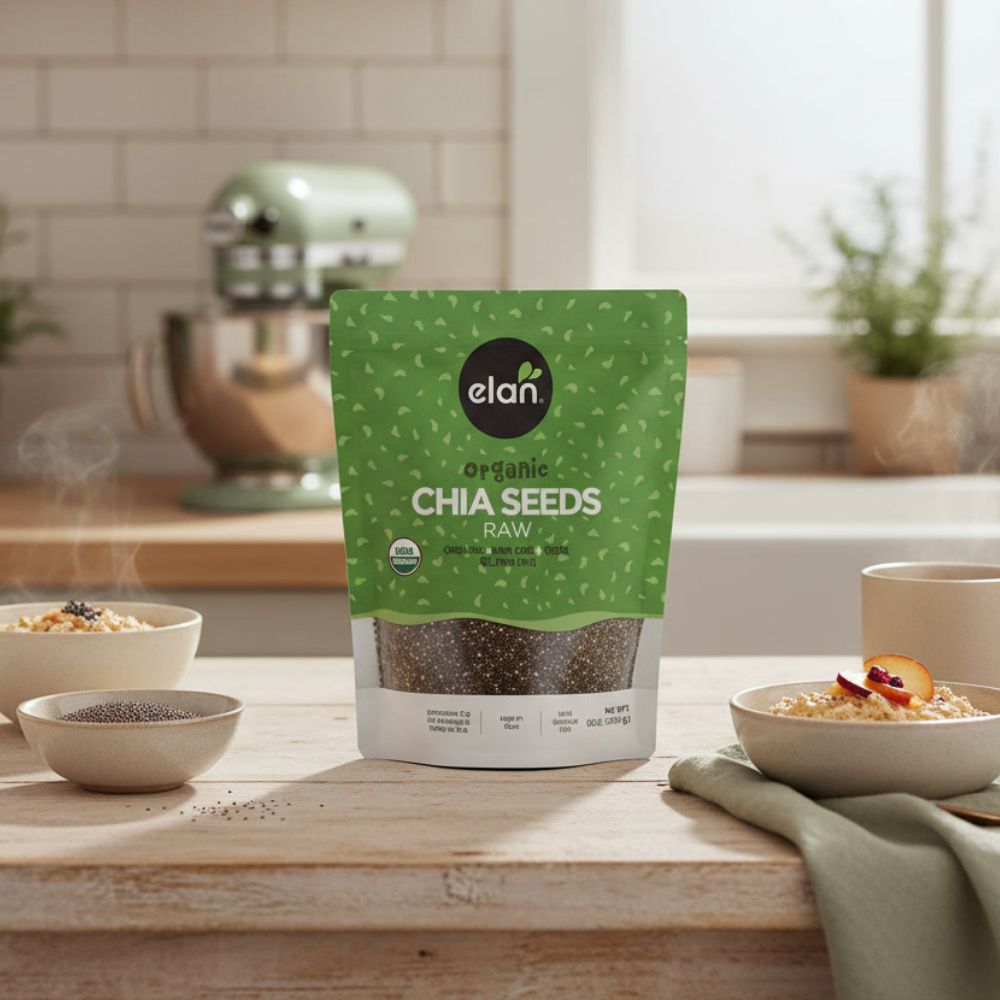 Elan Organic Chia Seeds, 8.8 oz bag on a kitchen counter with chia seed pudding in two bowls next to it.