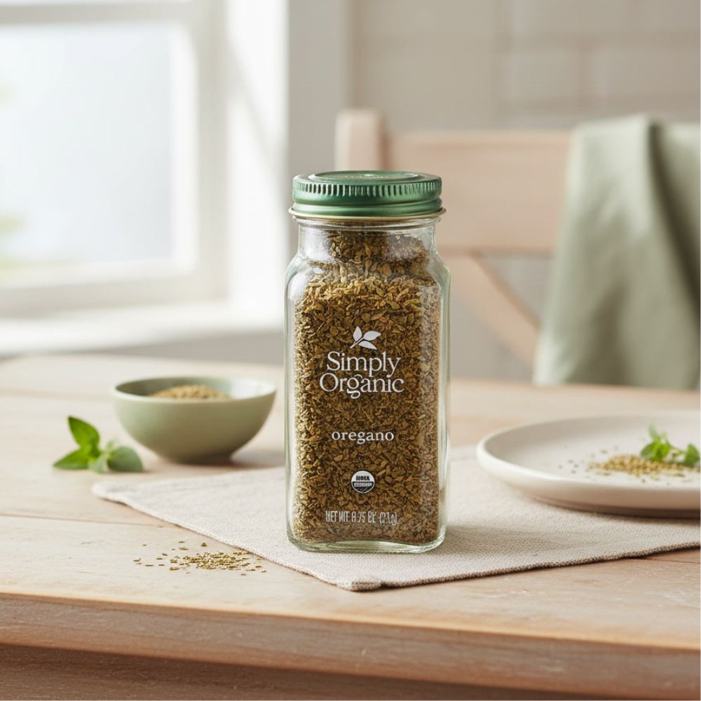 Simply Organic Oregano, .75 oz bottle on the kitchen counter with a bowl and plate behind it.